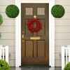 Two 15.7-inch artificial boxwood topiary balls mounted on a door, enhancing the entrance with a realistic green look.