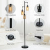Retro floor lamp with three amber glass shades and a sturdy metal pole, ideal for living rooms and bedrooms.