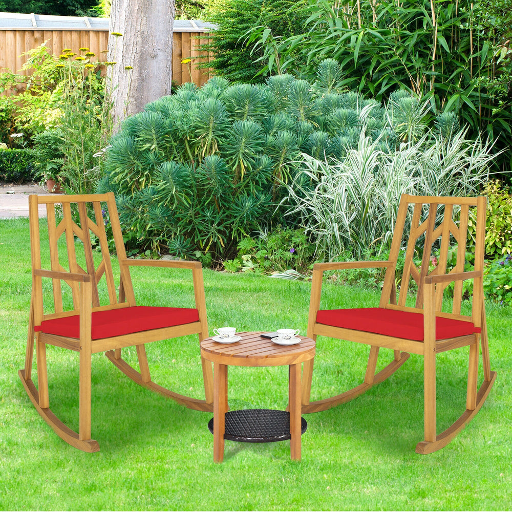 Patio acacia wood rocking chair set with red cushions, perfect for garden relaxation and outdoor seating.