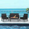 4-piece patio rattan furniture set with cushioned chairs and wooden tabletop, ideal for poolside relaxation.