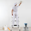 Folding 3-step ladder with handgrip and anti-slip platform, ideal for home or office use, shown in a painting scenario.