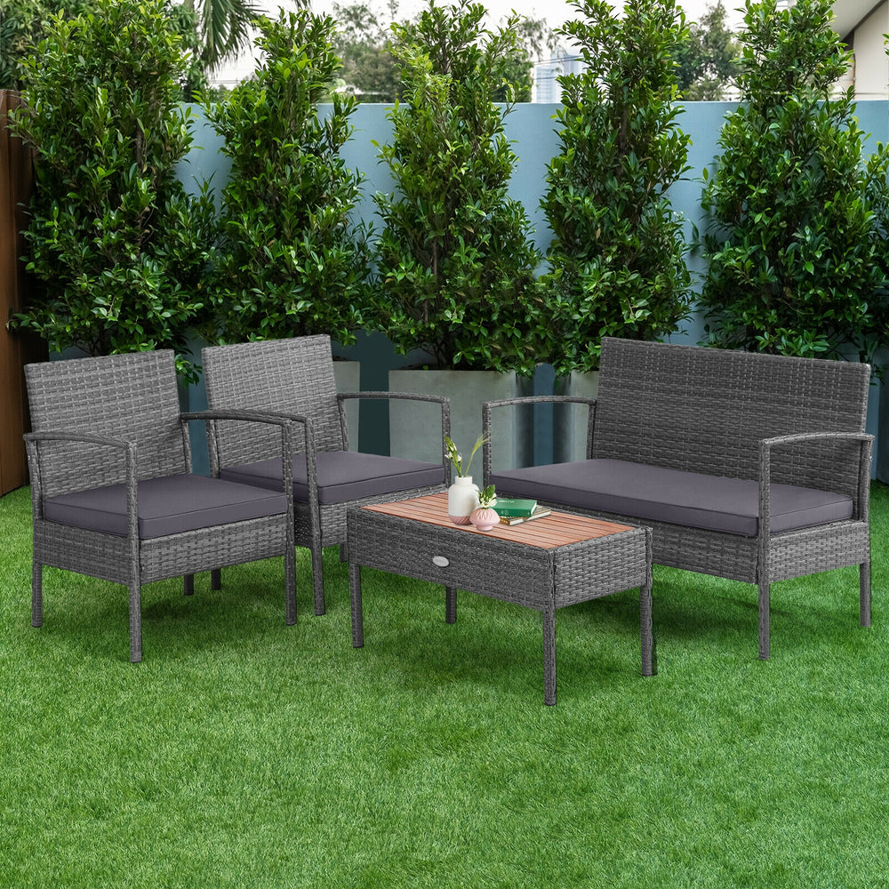 4-piece rattan patio conversation set with acacia wood tabletop, featuring two single sofas and a loveseat for outdoor.