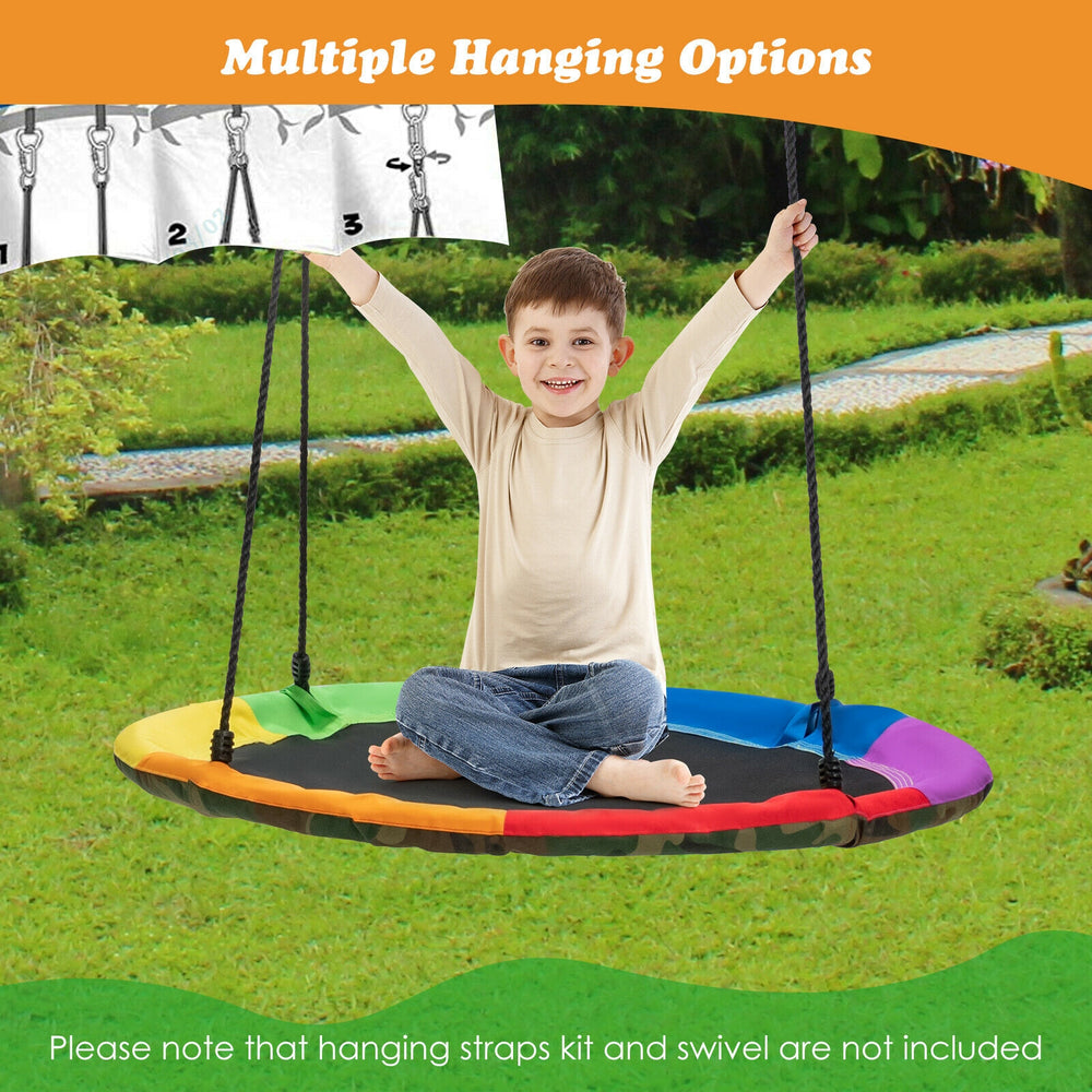 Child sitting on a colorful saucer tree swing, featuring a U-shaped seat and durable Oxford fabric for outdoor fun.