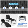 Foldable lounge chair in black with adjustable backrest and footrest, made of breathable fabric and sturdy steel frame.