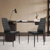 Modern leather dining chairs set with metal frame, featuring ergonomic backrest and padded seats for comfort.