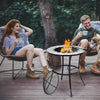 Round fire pit table with mesh cover and fire poker, perfect for outdoor gatherings on patio or backyard.