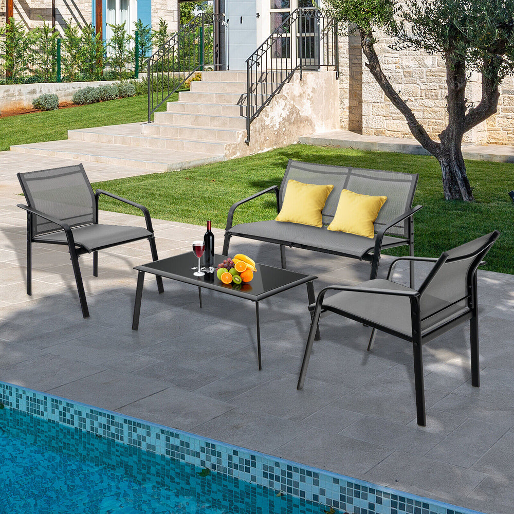 4-piece patio furniture set featuring a loveseat and glass table, designed for comfort and durability in outdoor spaces.