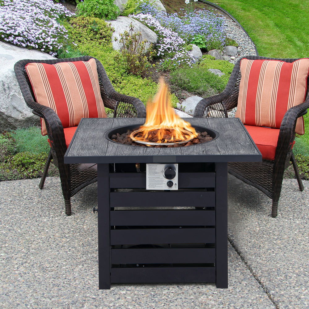 Square propane fire pit table with lava rocks, featuring adjustable flame control, ideal for patio and garden use.