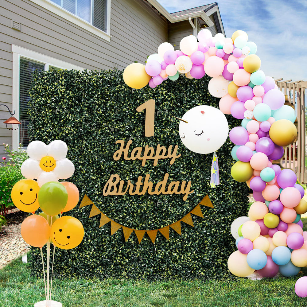 Artificial peanut leaf hedge panel with 4-layer leaves, ideal for vibrant outdoor decorations and events.
