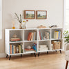 White 4-cube wooden bookshelf with 5 metal legs, perfect for organizing books and displaying decor in any room.