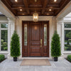 Two 4 FT artificial topiary cedar cypress trees in cement-filled pots, enhancing a grand entrance with greenery.