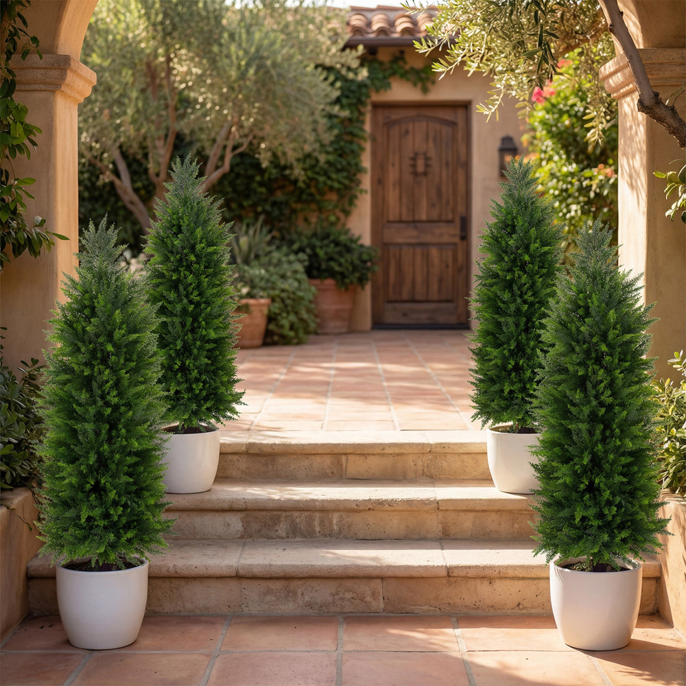 Set of 2 faux cedar cypress topiary trees in cement-filled pots, 4 ft tall, enhancing outdoor entryway decor.