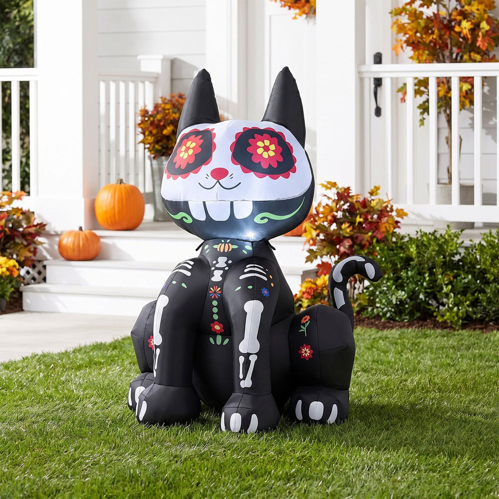 Colorful 4 FT Day of the Dead inflatable skull cat with LED light, perfect for gardens and porches during Halloween.