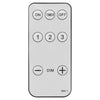 Remote control for adjusting lighting modes and brightness on a pre-lit potted Christmas tree with timer features.