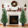 Two 4 FT pre-lit Christmas trees with 70 warm white LED lights and red berries, perfect for festive indoor decoration.