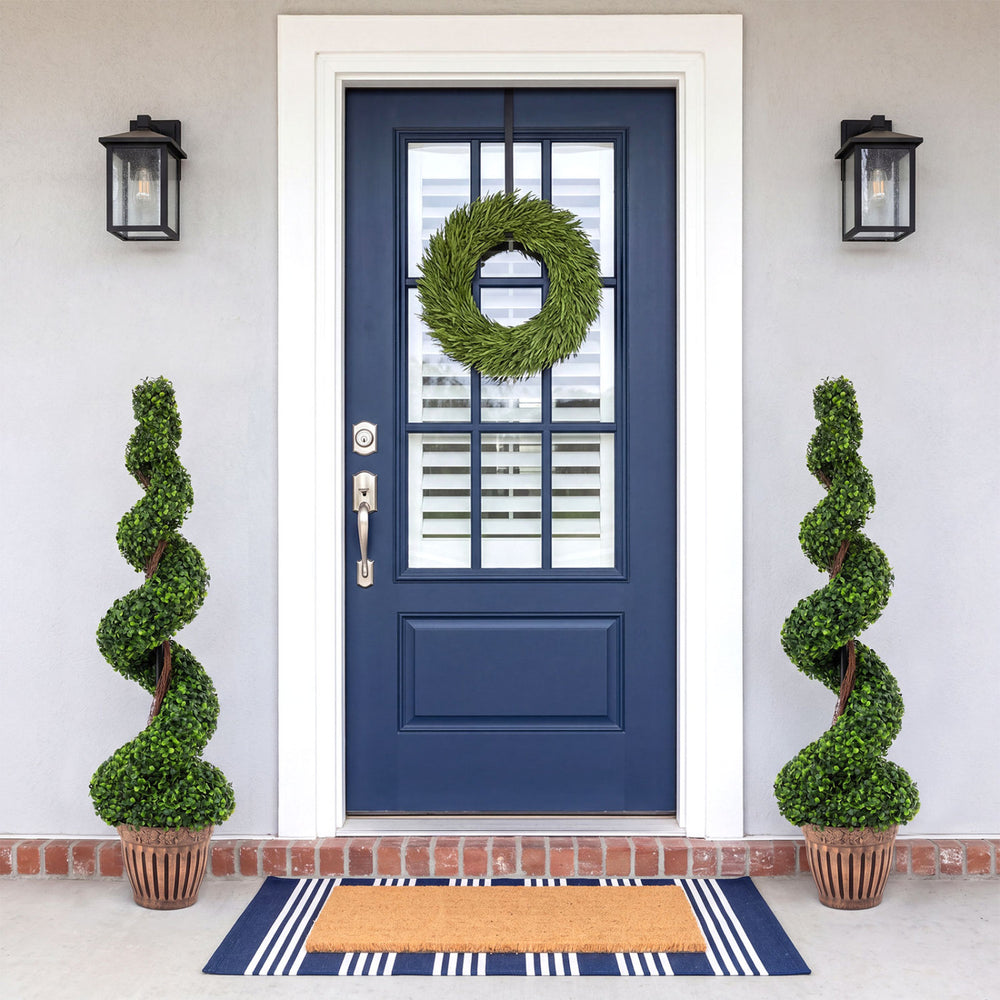 Lush green leaves adorn this 4 feet artificial boxwood spiral tree, enhancing any porch or balcony with effortless elegance.