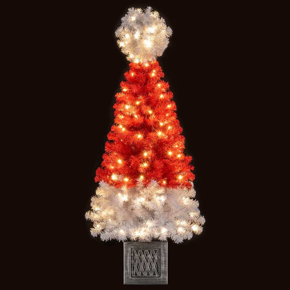 Vibrant 4 ft artificial Christmas tree with Santa hat design, featuring a retro flowerpot base and warm LED lights for.