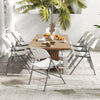 Eight white folding stackable chairs with metal frames around a wooden table, ideal for outdoor gatherings and events.