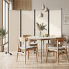 Beige 4-panel room divider with a sturdy metal frame, placed in a stylish living room setting for privacy and.
