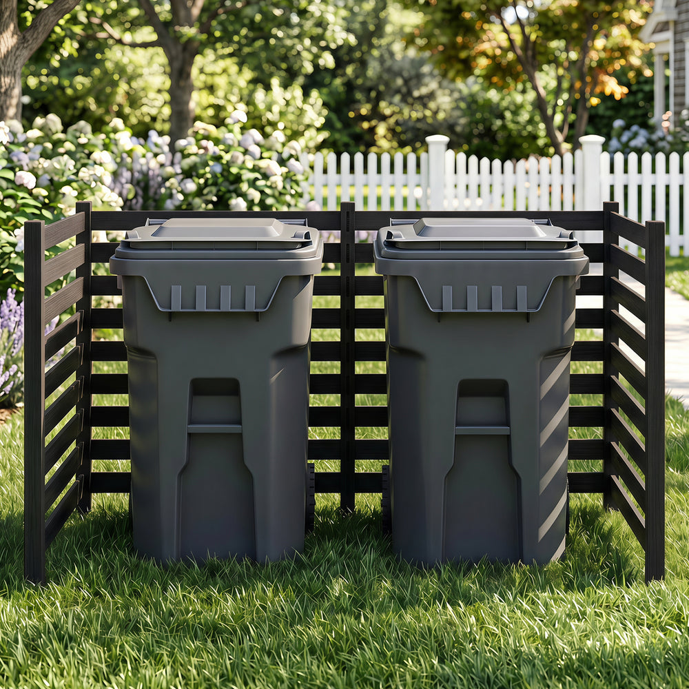 The black wooden outdoor privacy fence encloses trash cans, providing ventilation and a decorative touch to your yard.