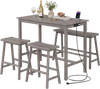 Counter height dining table set in gray with built-in charging station, sturdy rubber wood, and four backless stools.