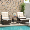 Two cushioned chairs and ottomans in a 4-piece outdoor furniture set with a glass-topped coffee table, perfect for.