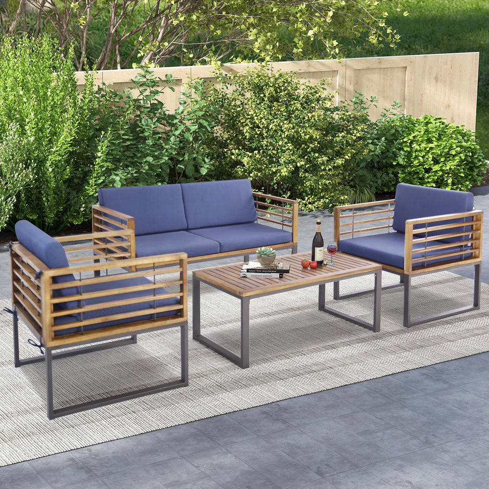 4-piece patio conversation set featuring acacia wood and navy cushions, perfect for backyard relaxation.
