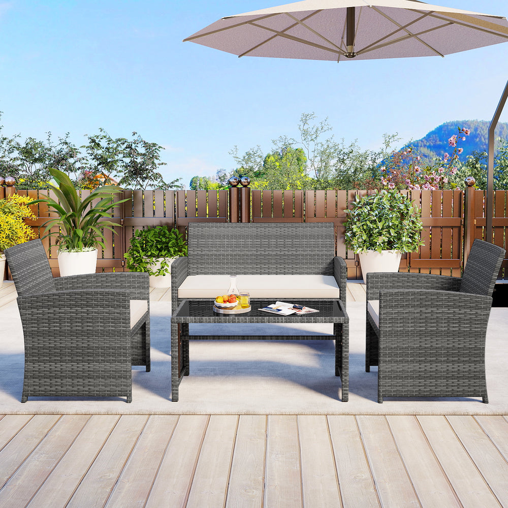 4-piece patio conversation set featuring gray PE rattan chairs and loveseat with soft cushions, ideal for outdoor.