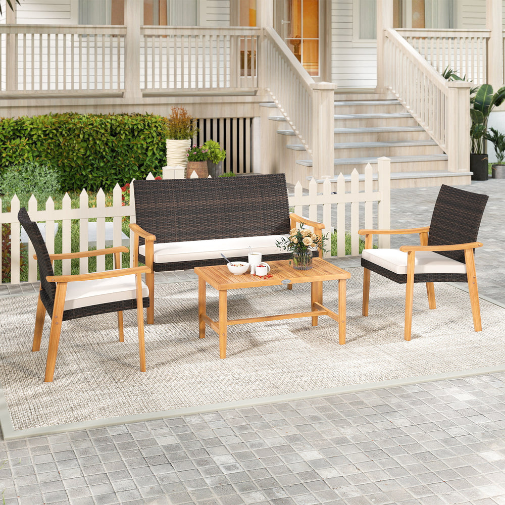 Single acacia wood chair from a 4-piece patio furniture set, featuring soft white cushions and elegant PE rattan design.