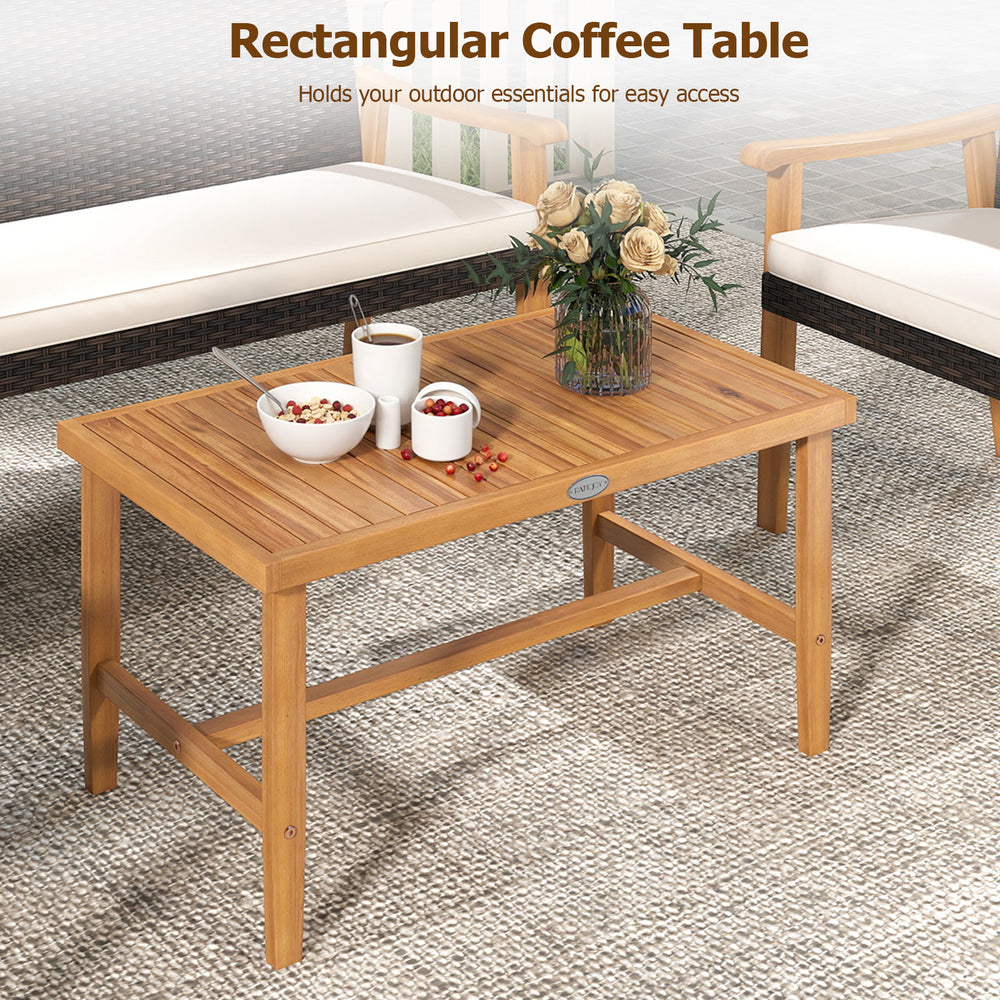 Rectangular acacia wood coffee table with a natural finish, ideal for holding outdoor essentials in patio settings.