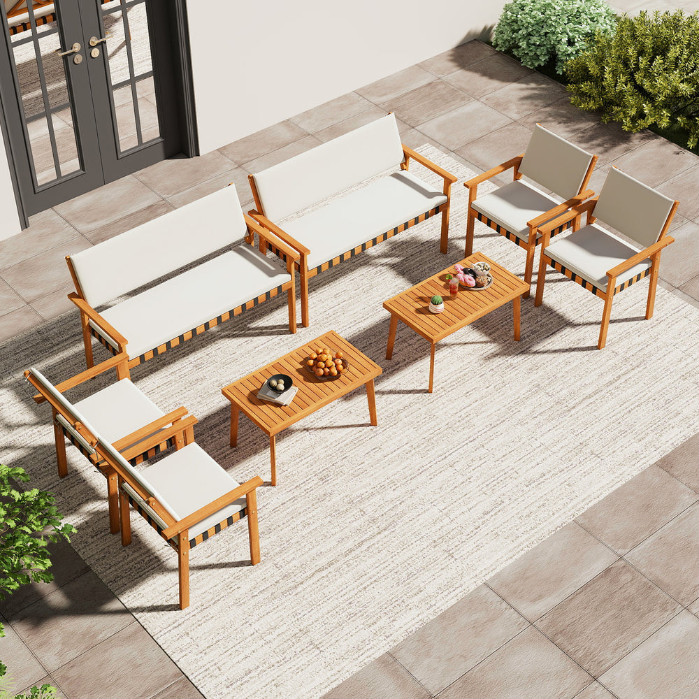Top view of the 4-piece patio furniture set with acacia wood and soft cushions, perfect for garden and balcony.