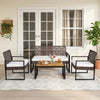 4-piece patio set featuring wicker chairs and an acacia coffee table, perfect for backyard relaxation.