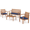 4-piece acacia wood patio furniture set with navy cushions, ideal for backyard and poolside relaxation.