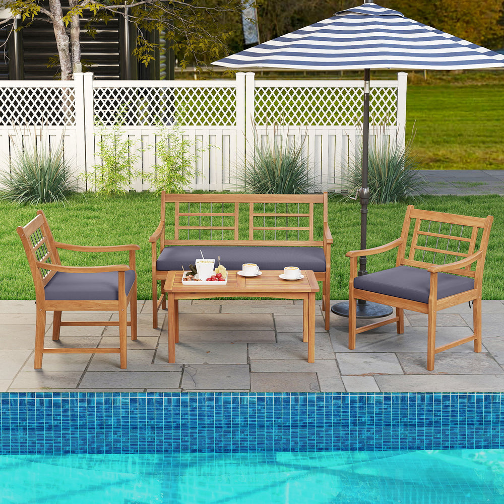 4-piece acacia wood patio furniture set with gray cushions, ideal for poolside relaxation and outdoor gatherings.