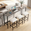 Counter height bar table with gray wood-like surface and three padded stools, featuring built-in outlets for device.