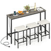 Counter height bar table with power outlet and three padded stools, featuring a rustic gray wood-like surface for.
