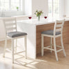 Counter height chairs with beige fabric seats and rubber wood legs, perfect for elegant kitchen gatherings.