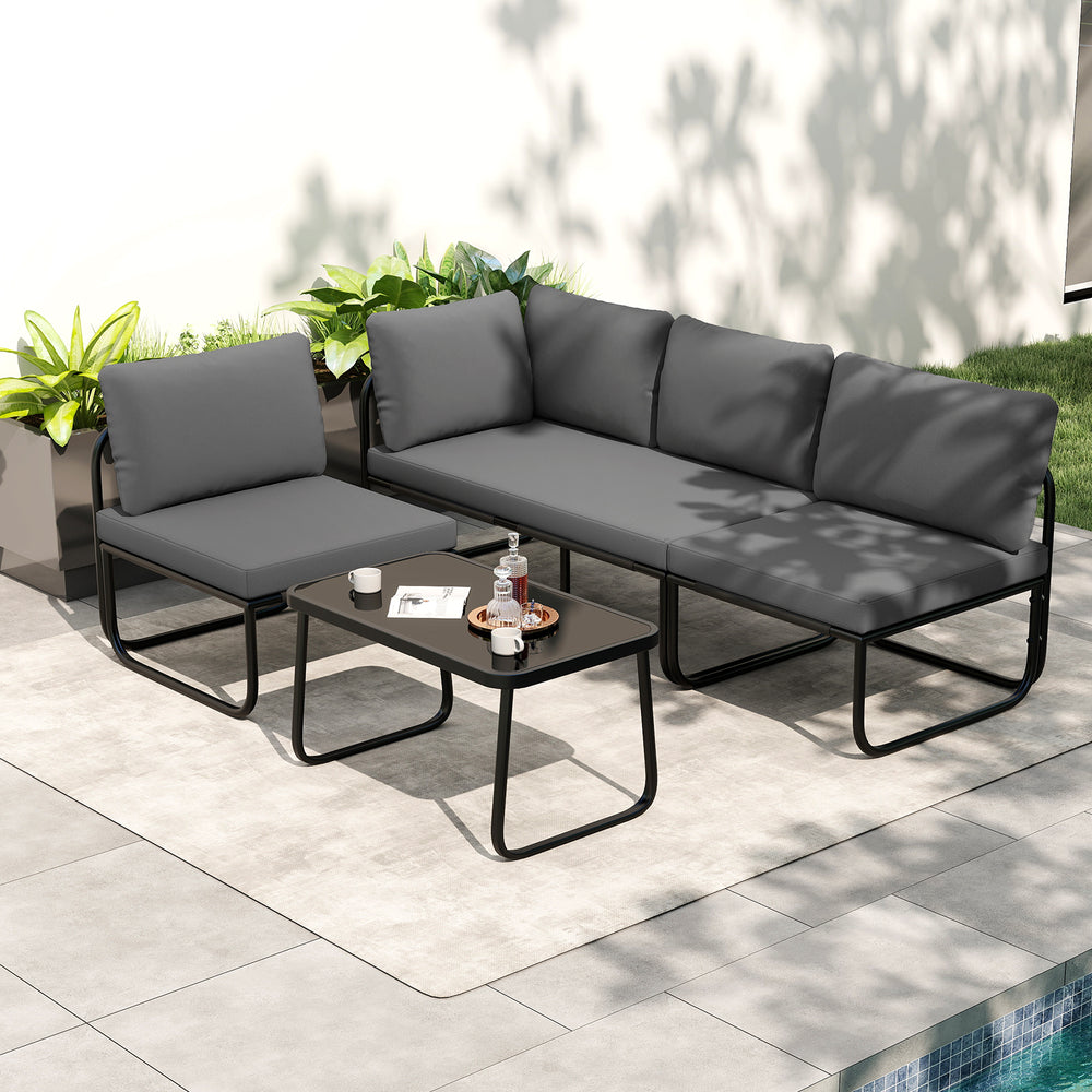 Gray 4-piece patio furniture set with cushions and coffee table, featuring sturdy metal construction for outdoor.
