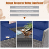 Navy blue cushions on a 4-piece patio rattan sofa set with a tempered glass coffee table, ideal for outdoor relaxation.