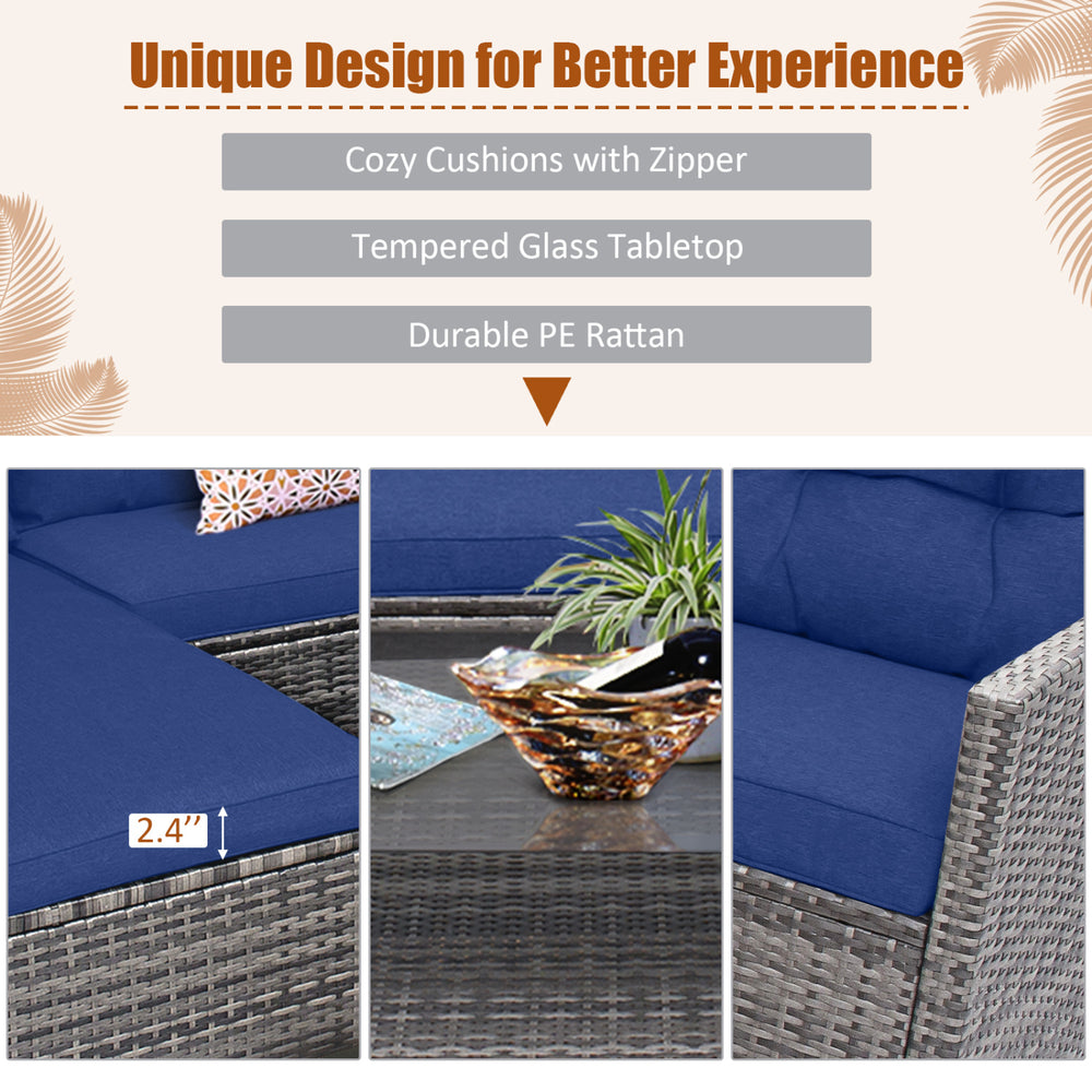 Navy blue cushions on a 4-piece patio rattan sofa set with a tempered glass coffee table, ideal for outdoor relaxation.