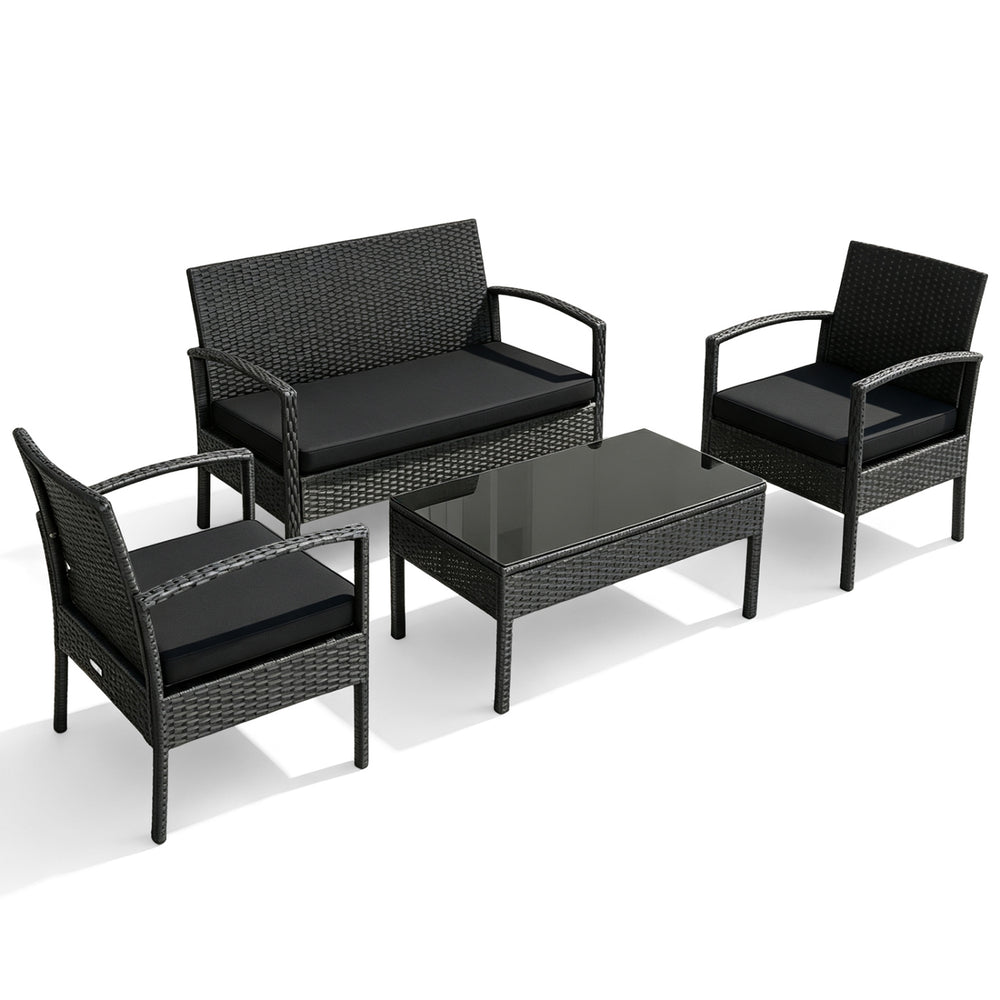 Patio rattan furniture set includes a loveseat, two single sofas, and a coffee table with cushions for outdoor relaxation.