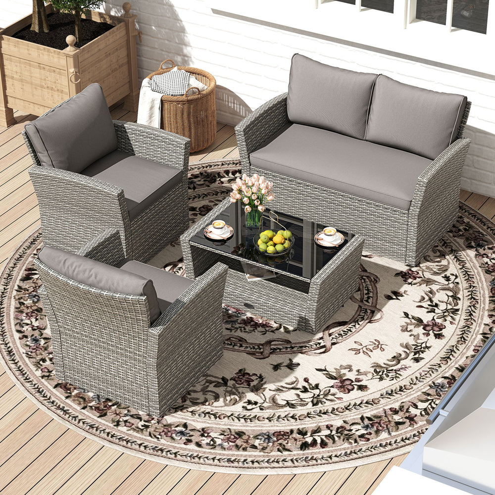 4-piece gray patio rattan furniture set with loveseat, armchairs, and coffee table, ideal for outdoor relaxation.