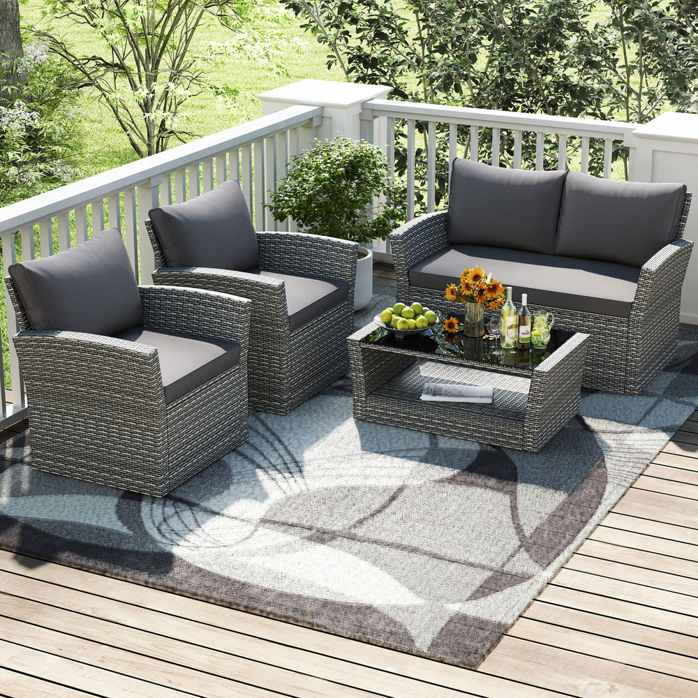 4-piece gray patio rattan furniture set with loveseat, armchairs, and coffee table, perfect for outdoor relaxation.