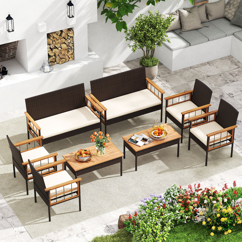 4-piece wicker furniture set featuring acacia wood tabletop and armrests, perfect for patio and garden relaxation.