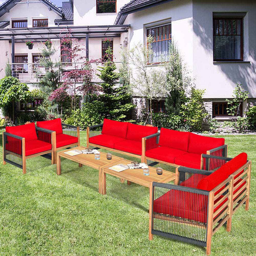Red cushioned wood patio furniture set arranged in a garden, showcasing versatility and comfort for outdoor spaces.