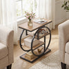 Narrow gray end table with a geometric metal frame and storage shelves, perfect for small living room spaces.