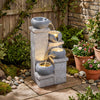 Cascading bowl water fountain with LED lights, showcasing a textured surface and peaceful water flow for outdoor.