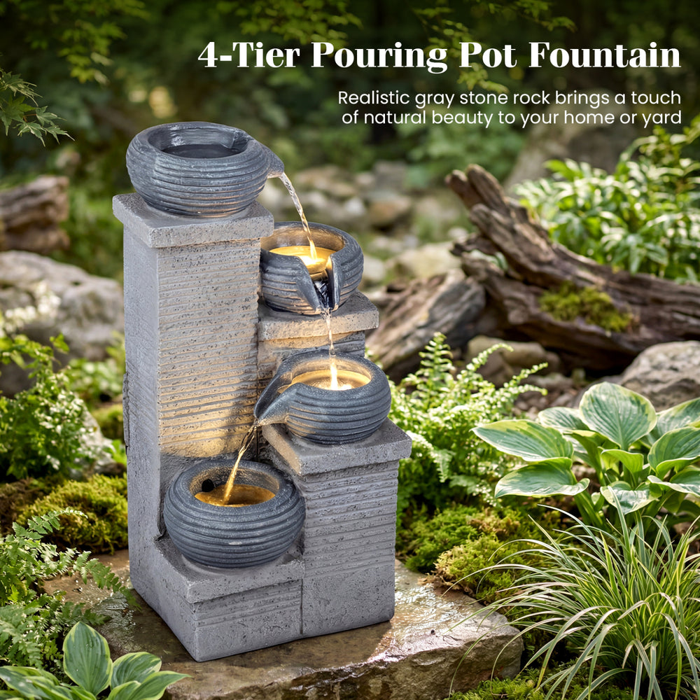 4-tier outdoor water fountain with cascading bowls, LED lights, and durable resin for a calming garden atmosphere.