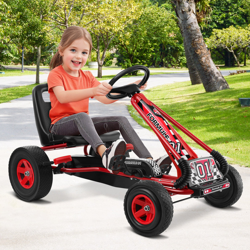 Kids pedal-powered go-kart in red with ergonomic seat, suitable for ages 3 to 8, for outdoor play on various surfaces.