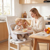 Convertible beige baby high chair with adjustable tray, footrest, and safety features for secure feeding and play.